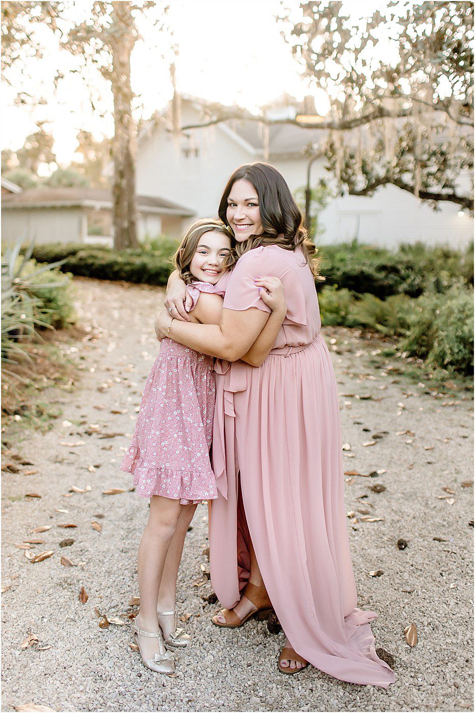 outdoor portrait of Tallahassee photographer Sarah hugging her daughter