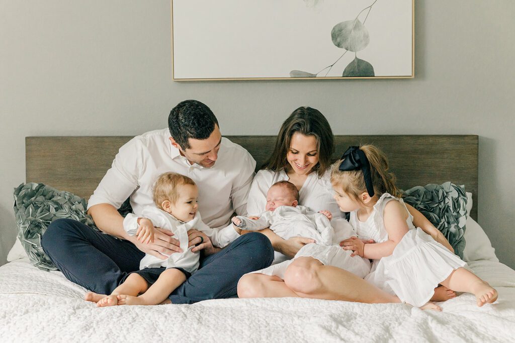 Baby number three welcomed home by two toddler siblings
