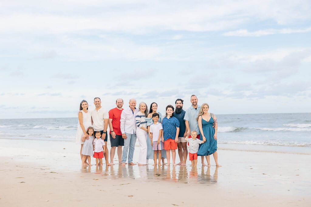 Multigenerational family photo session at the beach in North Florida with grandparents, parents, and young children