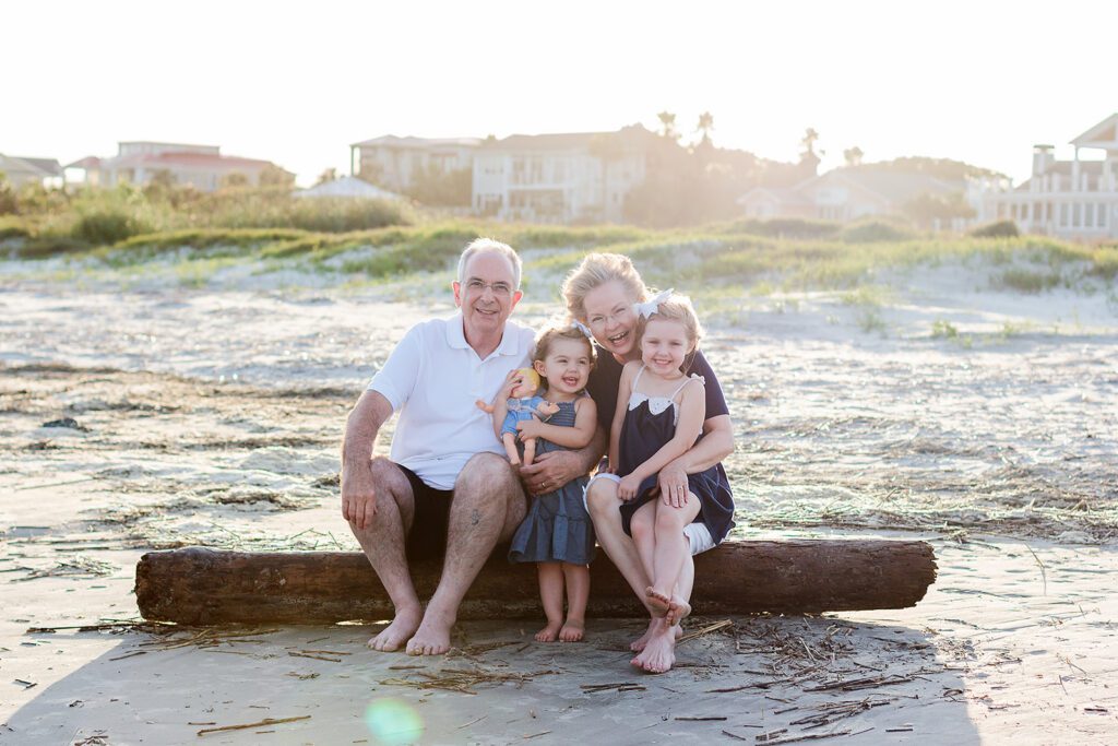 Vacation Family Photos: Capturing Real Moments (Without the Stress) on Your Family Trip 5 Family wearing coordinated neutral and blue outfits for vacation family photos with Tallahassee lifestyle photographer.